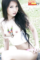 Felicia sitting astride bench long hair small tits
