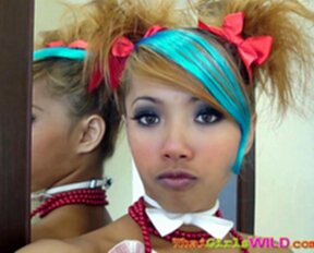 Air sucking lollipop with her hair in pigtails